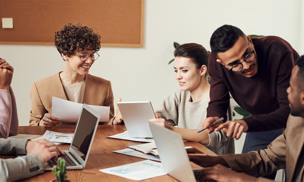 Elevate Your Employee Benefits Strategy in 2025 - Meeting in Casual Office